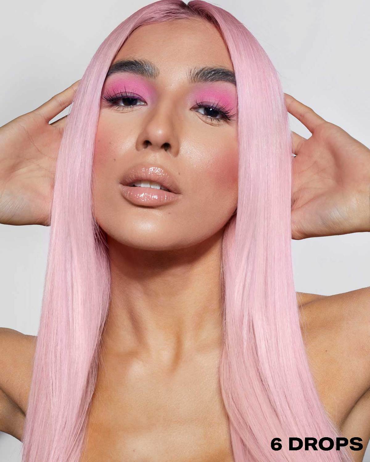Model wearing 6 drops of the hot pink 